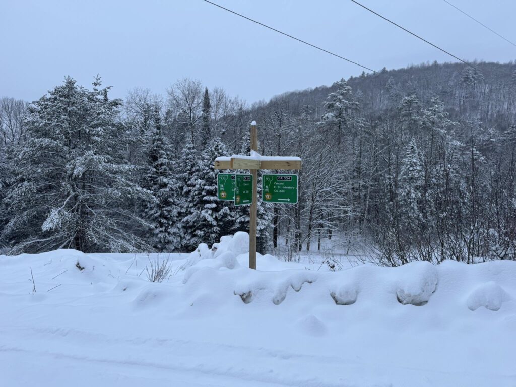Waterford Ridge Runners winter trail junction signs in fresh snow